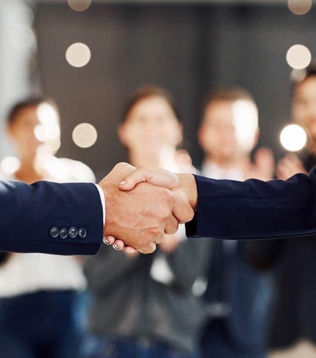 Business leaders discussing post-M&A integration through leadership strategy for growth